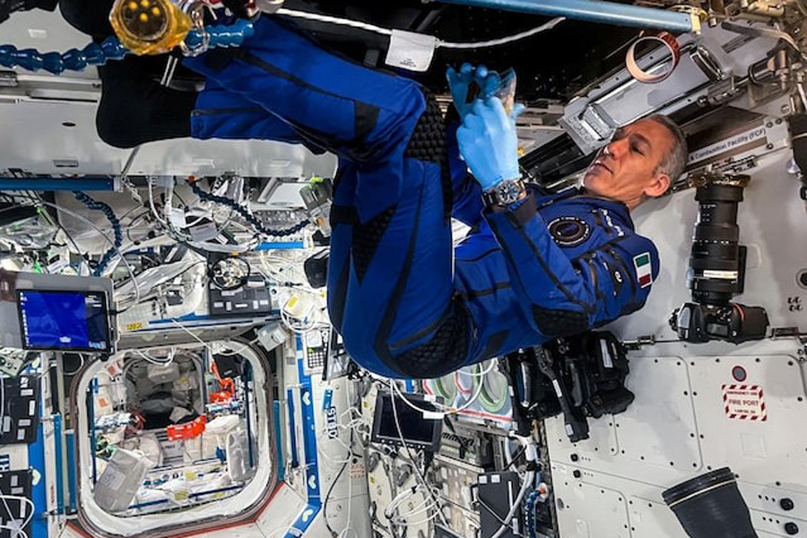 Italian Air Force astronaut Walter Villadei wears the SFS2 (Smart-Flight-Suit2) during the Ax-3 (Axiom Mission 3) mission aboard the International Space Station, in this undated handout photo.