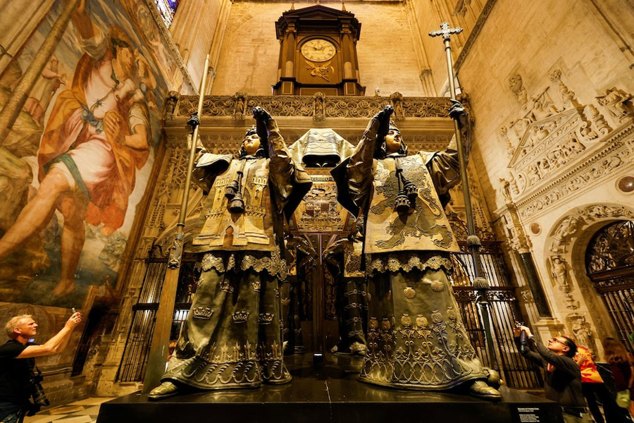 People visit the mausoleum of Christopher Columbus in the cathedral of Seville, Spain, October 11, 2024.
