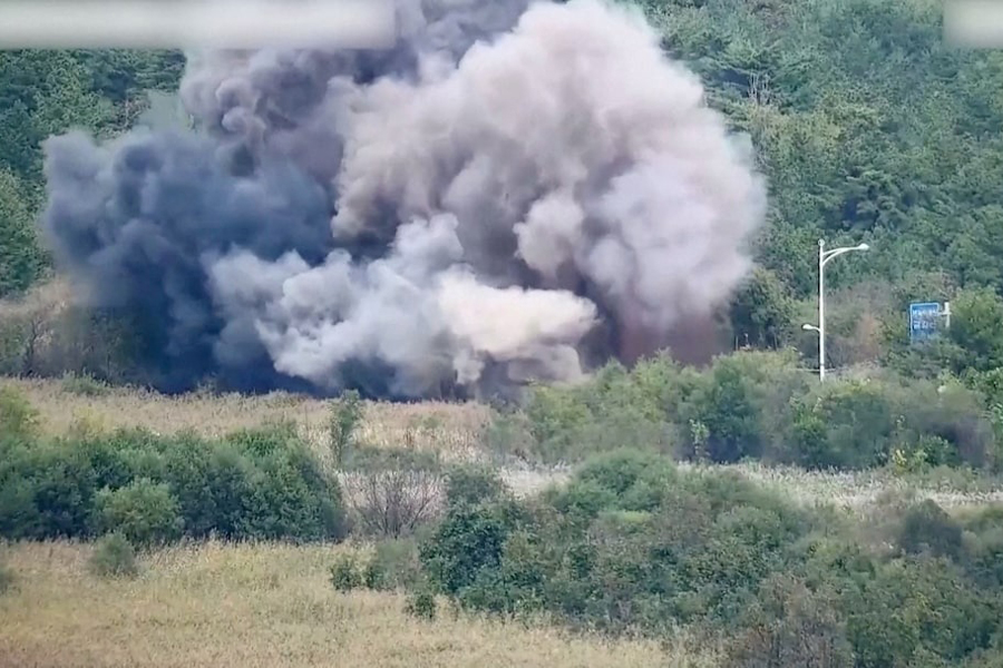 Smoke rises after North Korea blows up sections of inter-Korean roads on its side of the border between the two Koreas, according to South Korea's military, as seen from the South Korean side, October 15, 2024, in this screen grab from a handout video.