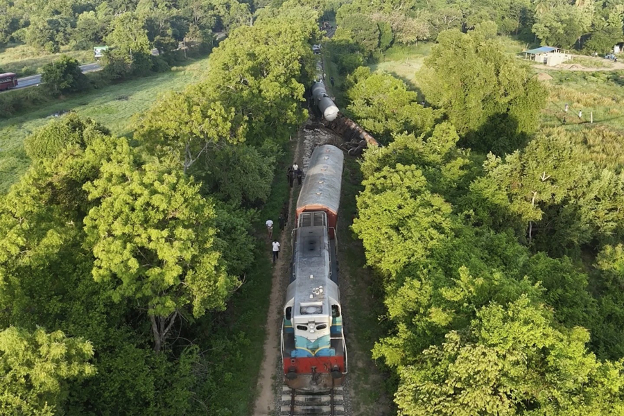 This image made from a video footage shows a derailed fuel transporting train in Minneriya, Sri Lanka, Saturday, Oct 19, 2024, after it collided with a heard of elephants Friday.