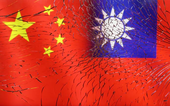 Chinese and Taiwanese flags are seen through broken glass in this illustration taken, April 11, 2023. REUTERS/Dado Ruvic/Illustration/File Photo