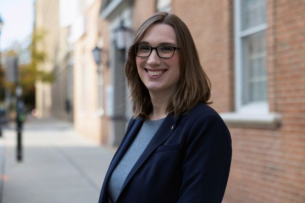 Sarah McBride, Delaware state senator and candidate for United States Representative, poses for a portrait outside of her campaign office in Wilmington, Delaware, U.S., October 26, 2024. REUTERS/Rachel Wisniewski/File Photo