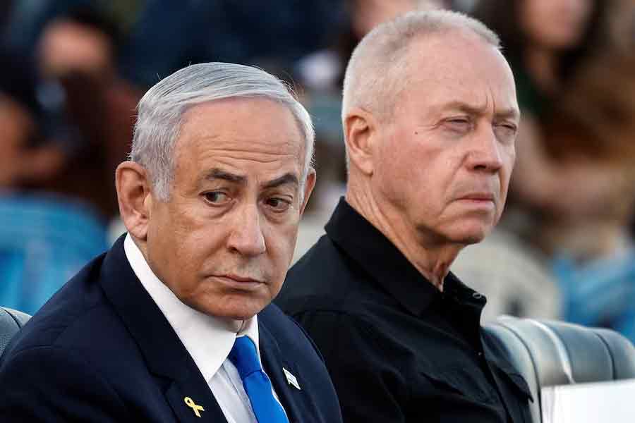 Israeli Prime Minister Benjamin Netanyahu and with sacked Defense Minister Yoav Gallant