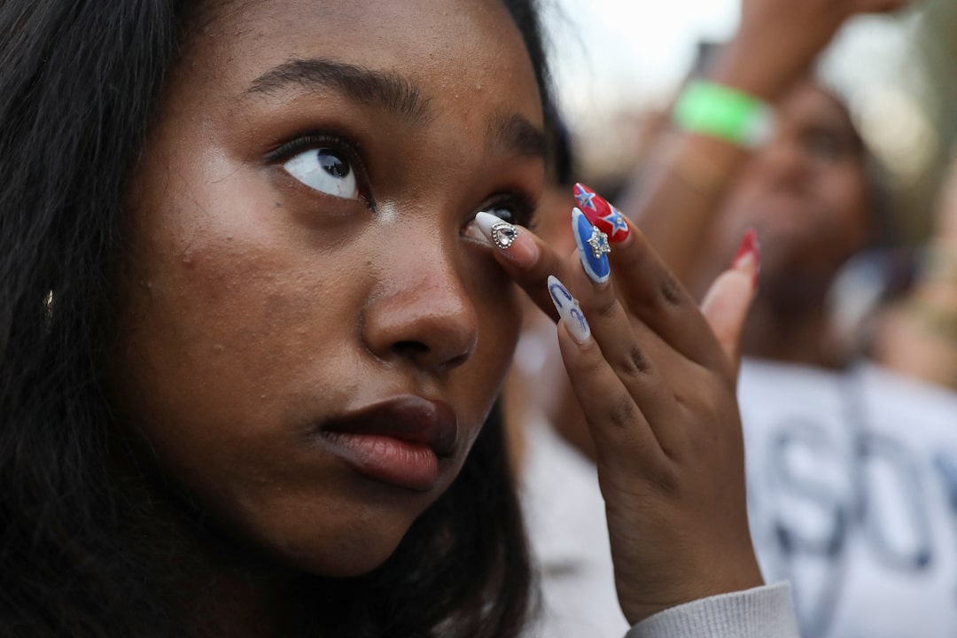 supporter reacts as Democratic presidential nominee U.S. Vice President Kamala Harris delivers remarks, conceding 2024 U.S. Presidential Election to President-elect Donald Trump, at Howard University in Washington, US, November 6, 2024. REUTERS/Alyssa Pointer