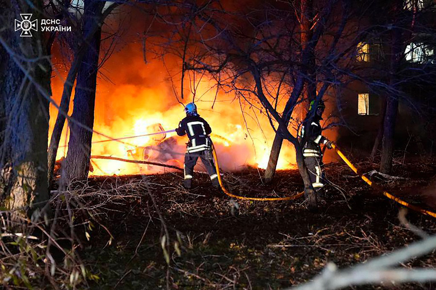 In this photo provided by the Ukrainian Emergency Service, firefighters extinguish the fire following a Russian rocket attack that hit a multi-storey apartment building in Sumy, Ukraine, Sunday, Nov 17, 2024.
