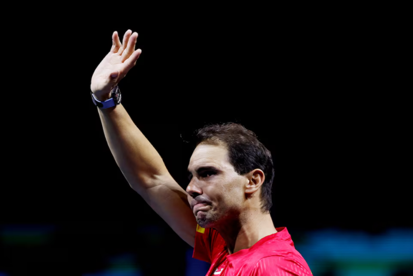 Tennis - Davis Cup Finals - Quarter Final - Netherlands v Spain - Palacio de Deportes Jose Maria Martin Carpena Arena, Malaga, Spain - November 20, 2024 Spain's Rafael Nadal waves at fans during a tribute to his career after The Netherlands eliminated Spain REUTERS/Juan Medina