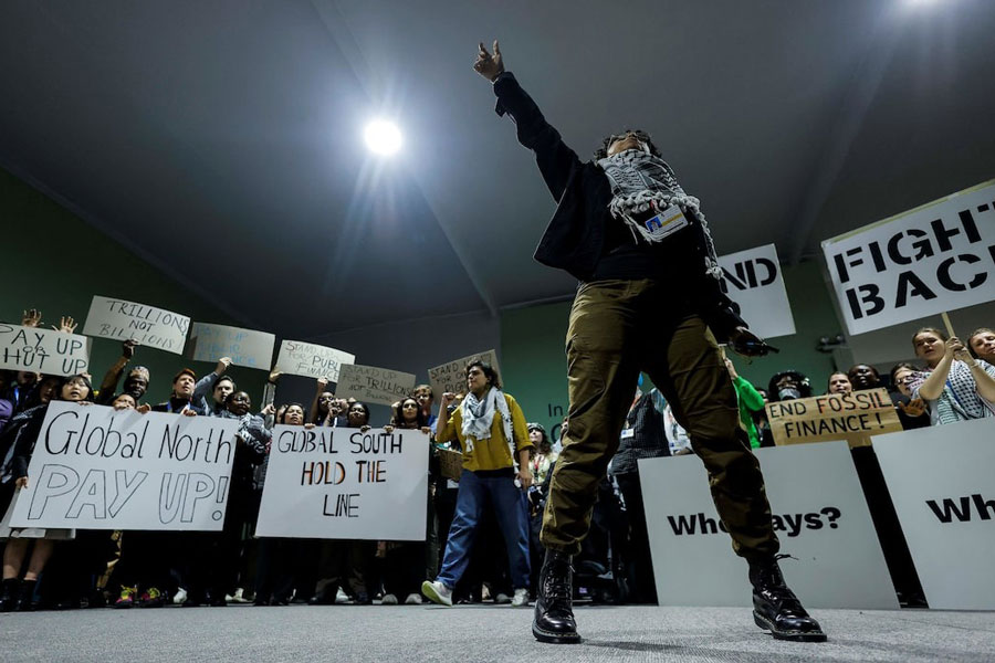 Activists shout slogans during a protest action at the COP29 United Nations climate change conference, in Baku, Azerbaijan November 23, 2024.