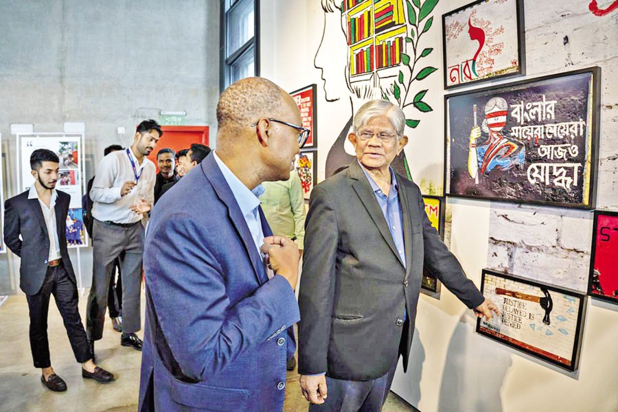 Finance Adviser Dr Salehuddin Ahmed having a look at the artworks after inaugurating the exhibition titled "Paint Your Sky, Make it Yours: Future Bangladesh in the Eyes of the Youth," at DrikPath Bhaban, Panthapath in the capital on Saturday
