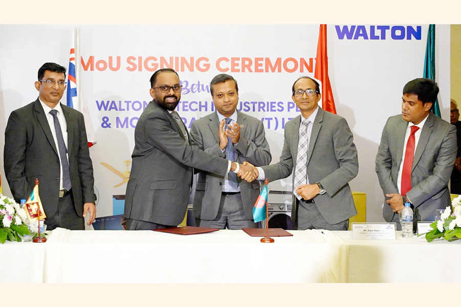 Higher officials of both organizations are seen at the MoU signing ceremony between Walton and Monik Trading.
