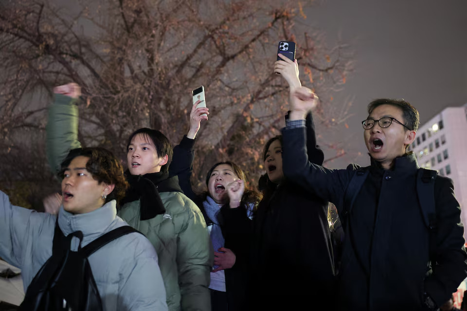 People shout slogans in front of the gate of the National Assembly, after South Korean President Yoon Suk Yeol declared martial law, in Seoul, South Korea on December 4, 2024 — Reuters photo