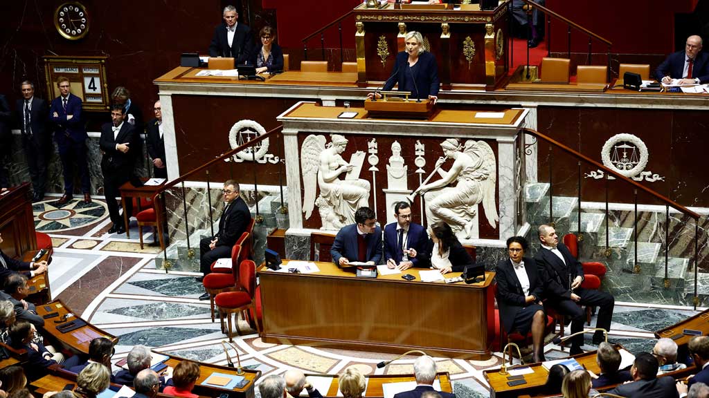 French far-right leader and member of parliament Marine Le Pen, President of the French far-right National Rally (Rassemblement National - RN) party parliamentary group, delivers a speech during a debate on two motions of no-confidence against the French government, tabled by the alliance of left-wing parties the "Nouveau Front Populaire" (New Popular Front - NFP) and the far-right Rassemblement National party, after the use by French government of the article 49.3, a special clause in the French Constitution, to push the budget bill through the National Assembly without a vote by lawmakers, at the National Assembly in Paris, France, December 4, 2024. REUTERS