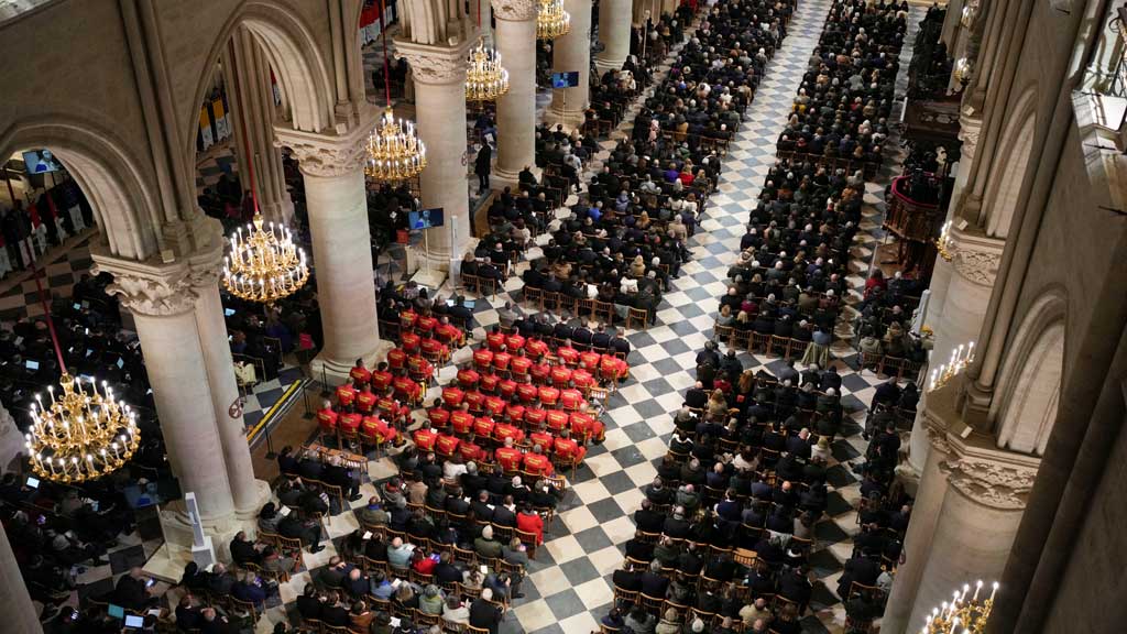 Guest attend the service during the re-opening of the Notre-Dame de Paris Cathedral, following the 2019 fire, in Paris, France, December 7, 2024.
