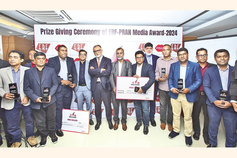 Winners of the 'ERF-Pran Media Award 2024' pose with Commerce adviser Sheikh Bashir Uddin at the award ceremony at the auditorium of the Economic Reporters' Forum in Dhaka on Tuesday