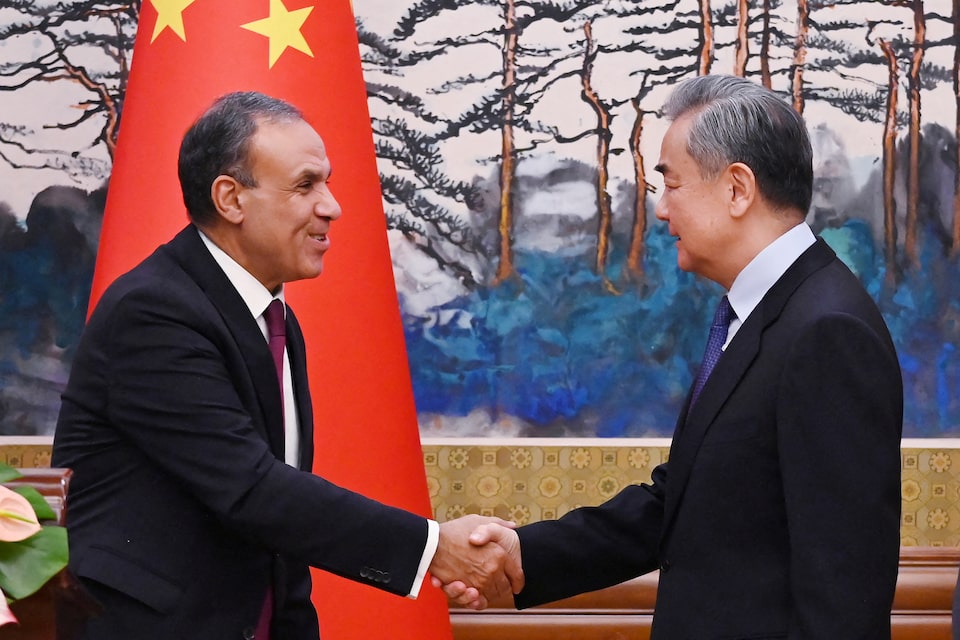Egyptian Foreign Minister Badr Abdelatty and Chinese Foreign Minister Wang Yi shake hands after a joint briefing in Beijing’s Diaoyutai State Guesthouse on December 13, 2024 . GREG BAKER/Pool via REUTERS
