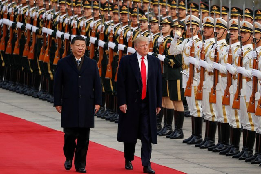 US President Donald Trump takes part in a welcoming ceremony with China's President Xi Jinping in Beijing, China on November 9, 2017 — Reuters/File