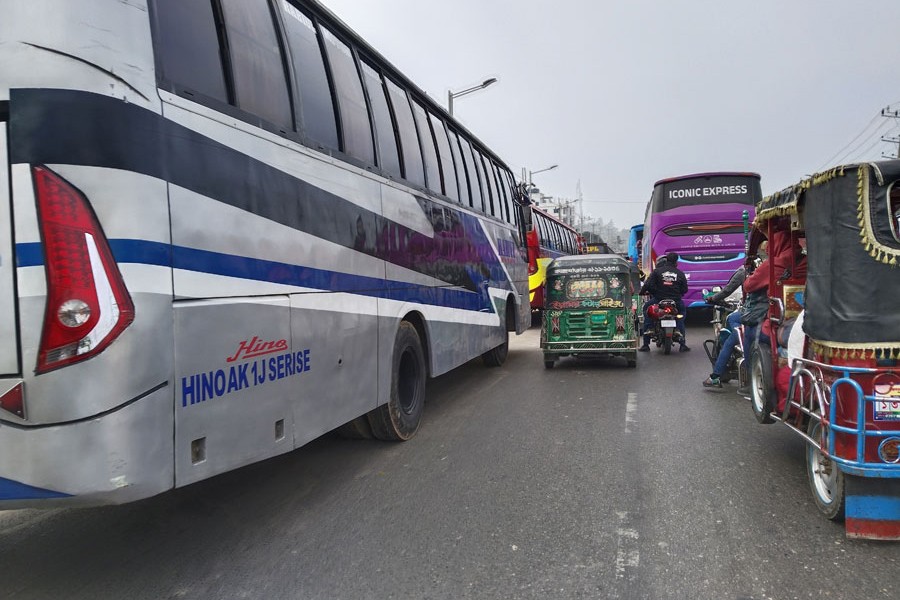 Vehicles stuck in a traffic jam extending from the bus terminal to the Kolatali Dolphin intersection in Cox's Bazar tourist town
