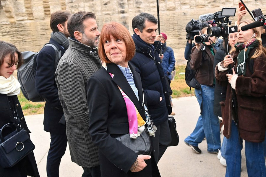Frenchwoman Gisele Pelicot, the victim of an alleged mass rape orchestrated by her then-husband Dominique Pelicot at their home in the southern French town of Mazan, arrives with her lawyers Stephane Babonneau and Antoine Camus to attend the verdict in the trial for Dominique Pelicot and 50 co-accused, at the courthouse in Avignon, France, December 19, 2024.