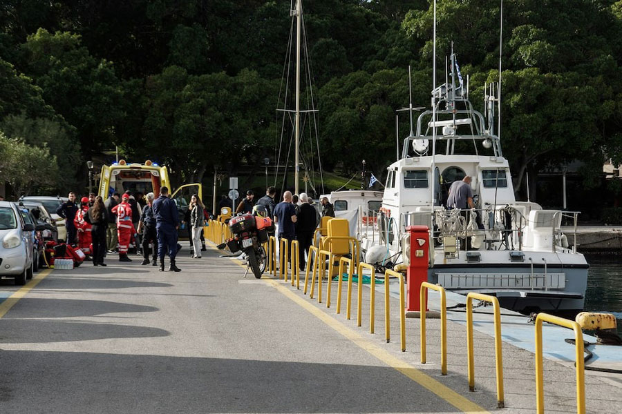 Paramedics and coast guard officers transfer the bodies of migrants following a collision off the island of Rhodes, Greece, December 20, 2024.