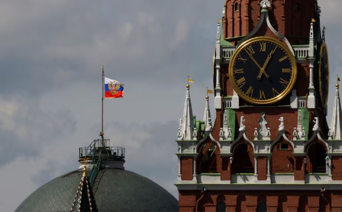 The Russian flag flies on the dome of the Kremlin Senate building behind Spasskaya Tower, while the roof shows what appears to be marks from the recent drone incident, in central Moscow, Russia, May 4, 2023. REUTERS/Stringer/File Photo