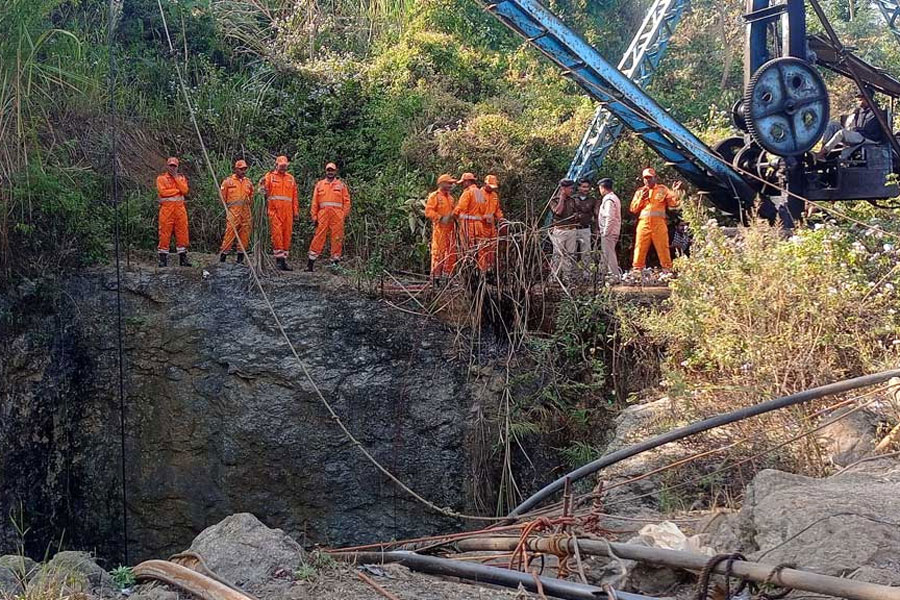 Members of a rescue team stand next to a pulley machine during a rescue operation for trapped miners in Umrangso in Dima Hasao district in the northeastern state of Assam, India, January 7, 2025.