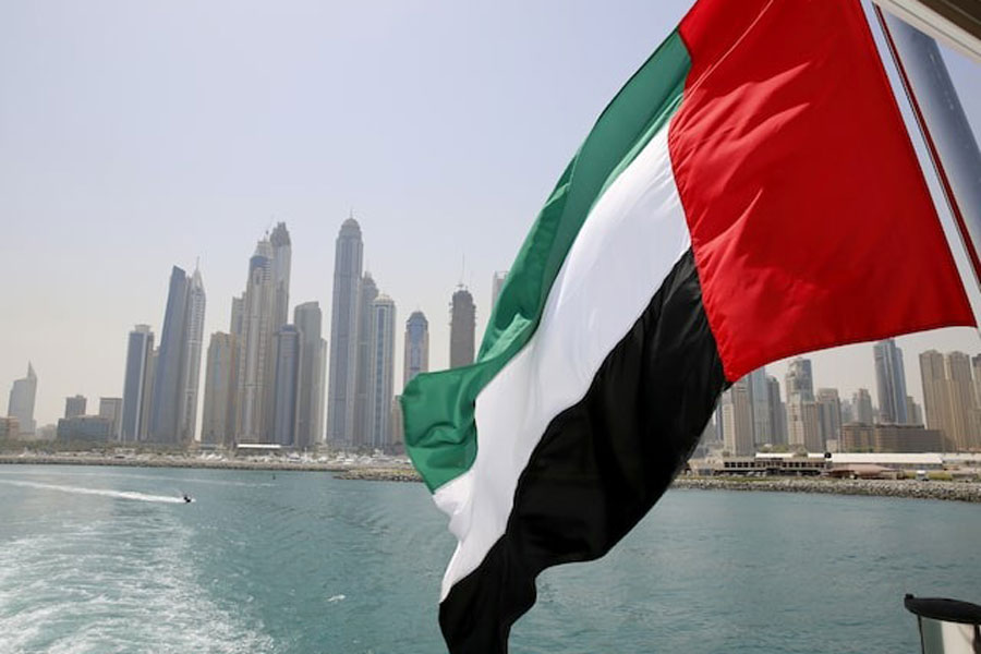 UAE flag flies over a boat at Dubai Marina, Dubai, United Arab Emirates May 22, 2015.