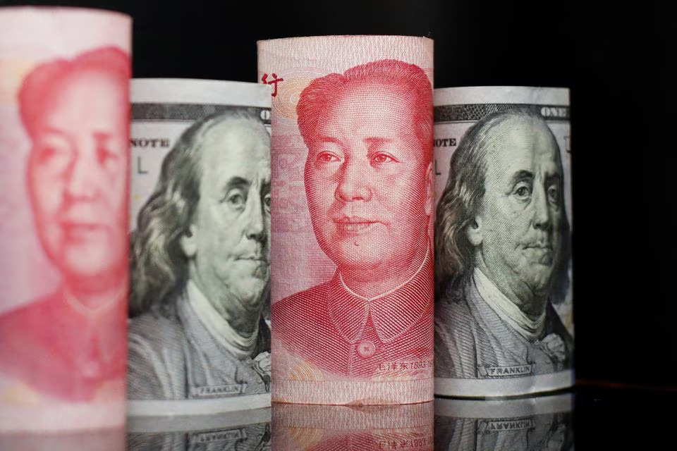 Banknotes of Chinese yuan and US dollar are seen in this illustration picture taken on September 29, 2022 — Reuters illustration/Files