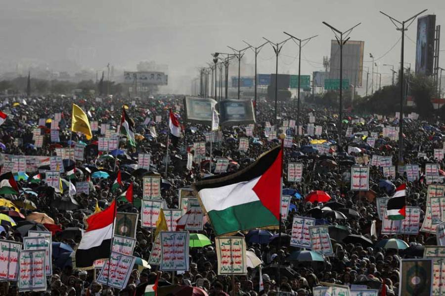 A protester waves a Palestinian flag during a rally of protesters, mainly Houthi supporters, to show support to Palestinians in the Gaza Strip, in Sanaa, Yemen Jan 3, 2025.