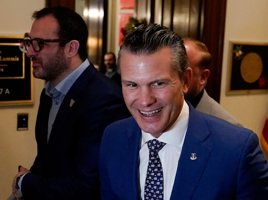 Defense secretary nominee Pete Hegseth walks through Capitol Hill in Washington, US, December 11, 2024.