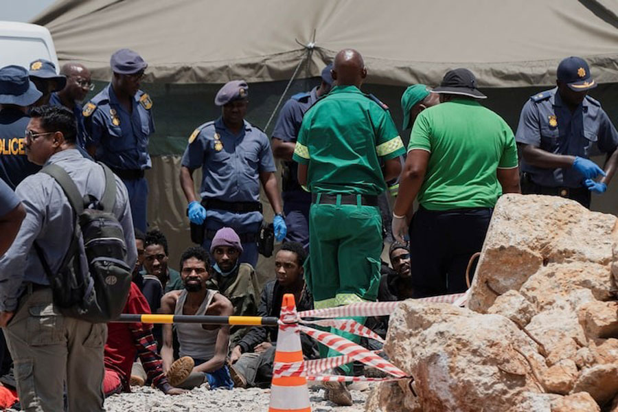 Rescued miners are seen as they are processed by police after being rescued at the mine shaft where rescue operations are ongoing as attempts are made to rescue illegal miners who have been underground for months, in Stilfontein, South Africa, January 14, 2025.