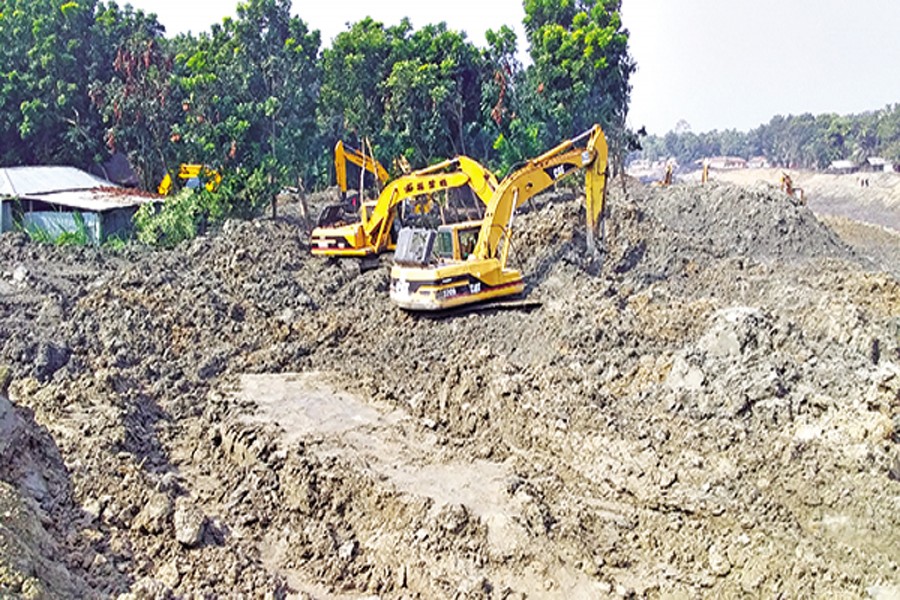 Under a mega project, dredging work is going on in Santhia upazila of Pabna district to revive the ailing Ichhamati River
