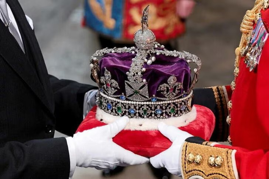 The Imperial State Crown arrives through the Sovereign's Entrance, ahead of the State Opening of Parliament, in the House of Lords Chamber in the Houses of Parliament in London, Britain on May 10, 2022 — Pool via Ruters/Files