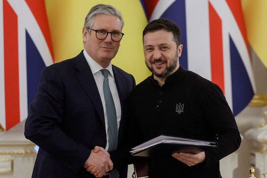 British Prime Minister Keir Starmer and Ukraine's President Volodymyr Zelenskiy shake hands after a signing ceremony, amid Russia's attack on Ukraine, in Kyiv, Ukraine January 16, 2025.