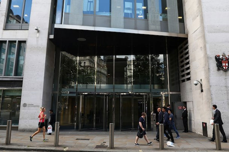 Pedestrians pass the London Stock Exchange in London, Britain August 15, 2017.