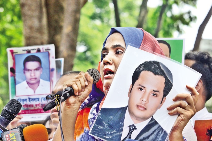 Relatives of the disappeared form a human chain at the Central Shaheed Minar on International Day for the Protection of All Persons from Enforced Disappearances on August 30, 2024 — FE/file