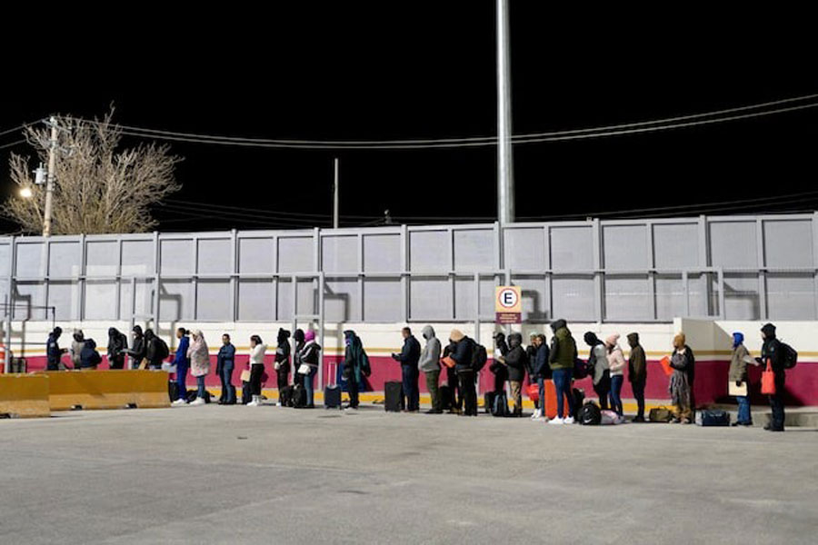 Asylum seekers with appointments made through the US Customs and Border Protection CBP One application scheduled for the morning of January 20, the final asylum appointment in Piedras Negras before the inauguration of US President-elect Donald Trump, wait at the entrance of the Camino Real International Bridge in Piedras Negras, Coahuila, Mexico, January 20, 2025.