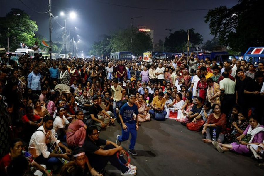 People sit and chant slogans as they attend a protest condemning the rape and murder of a trainee medic at a government-run hospital, in Kolkata, India on October 15, 2024 — Reuters/File