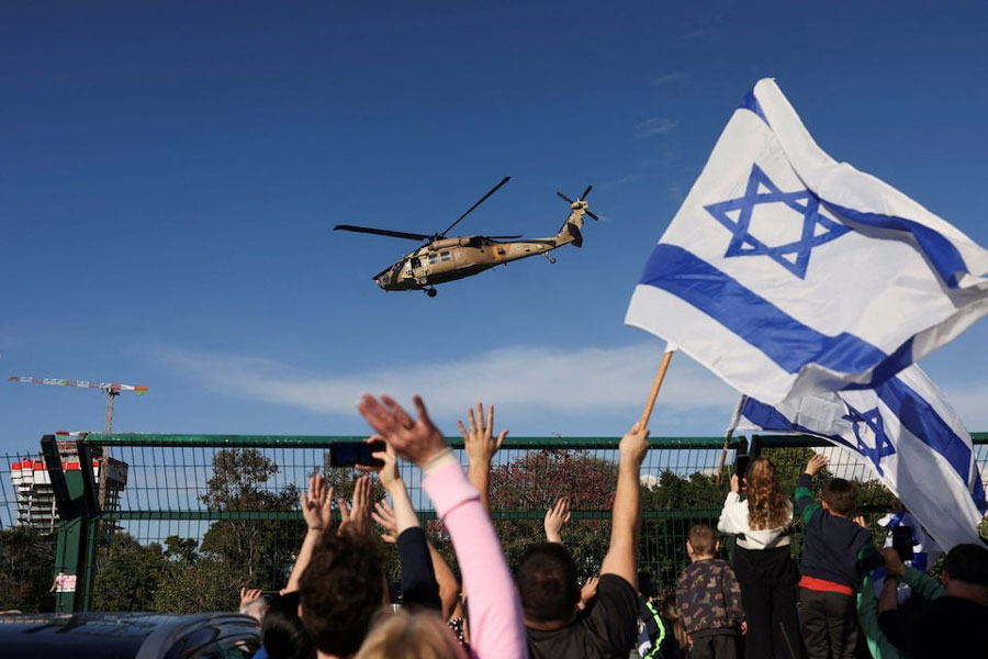 An Israeli military helicopter transporting released Israeli hostages, who have been held in Gaza since the deadly October 7, 2023 attack by Hamas, as part of a prisoner-hostage exchange deal between Israel and Hamas, arrives at Beilinson Schneider complex, in Petah Tikva, Israel, January 25, 2025.