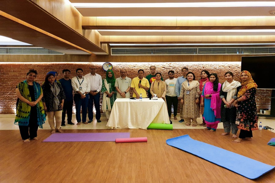 BRAC Bank employees attend a yoga session as the bank has introduced yoga classes for its employees as part of its wellness drive.