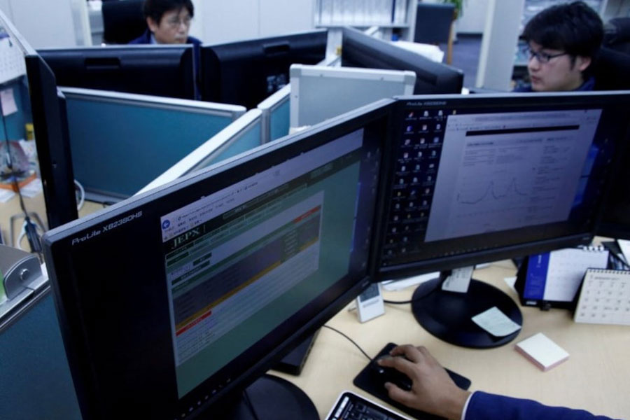 Employees work at Japan Electric Power Exchange's office in Tokyo, Japan, January 24, 2017.