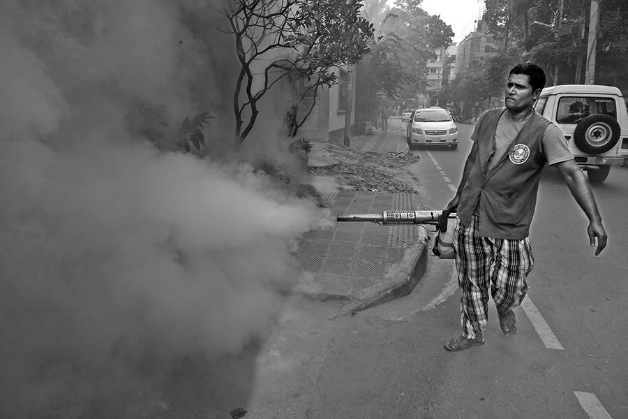 A worker of city corporation sprays anti-mosquito fog in an effort to prevent mosquitoes from breeding at a neighbourhood in Dhaka city — FE/files