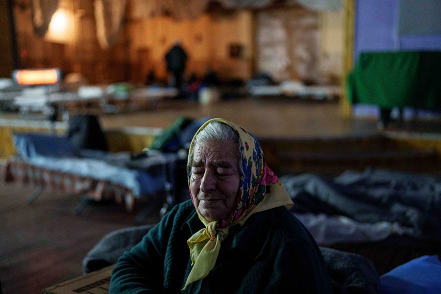 Kateryna Odraha, 83, cries after evacuation from the frontline village Andiivka, Donetsk region at a center for displaced people in Pavlohrad, Ukraine, Saturday, Feb 1, 2024.