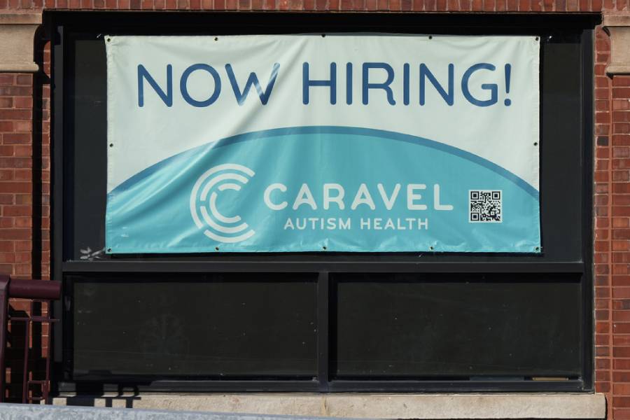 Hiring sign is displayed at a health service center in Chicago, Tuesday, Jan. 21, 2025.