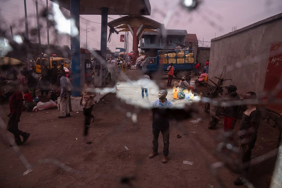 A man stands in front of a gas station office that was hit by light and heavy weapons during the fighting in the town that led to the fall of Goma to the M23 rebels, eastern Democratic Republic of Congo, February 5, 2025.