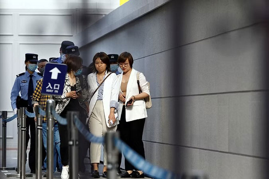 Teresa Xu walks out of the No. 3 Intermediate People's Court after a court hearing of her suit against a Beijing hospital for rejecting her request to freeze her eggs on the grounds that she is unmarried, in Beijing, China May 9, 2023.
