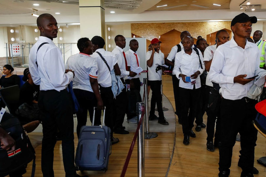 Kenyan job seekers taking part in the government's most ambitious employment initiatives ever queue to be processed at the immigration desk at the Jomo Kenyatta International Airport in Nairobi, Kenya, December 11, 2024.