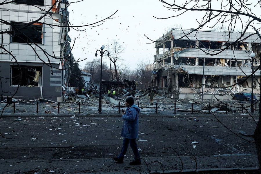 A man walks near the site of a Russian missile strike in Kyiv, February 12, 2025.