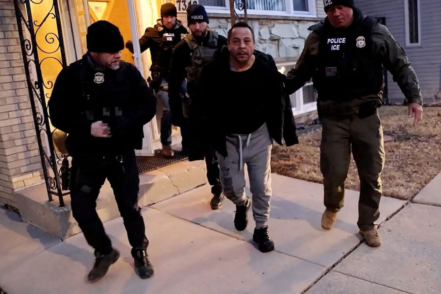 US Immigration and Customs Enforcement (ICE) agents conduct an arrest as part of US President Donald Trump's wide-ranging immigration crackdown in Chicago, Illinois, US January 26, 2025 in a still image from video.