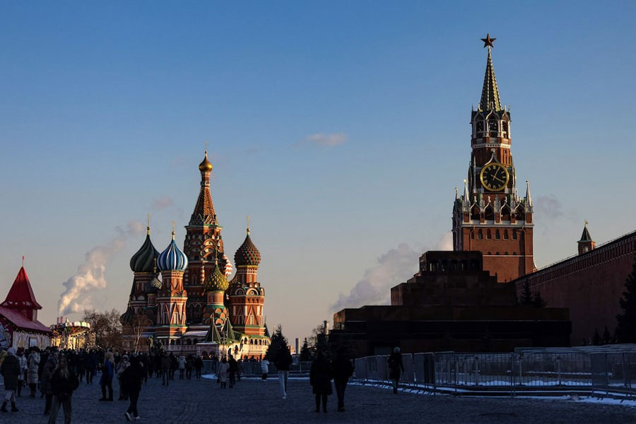People walk in Red Square on a sunny day in Moscow, Russia, February 23, 2025.