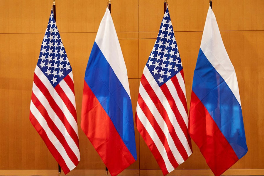 Russian and US flags are pictured before talks between Russian Deputy Foreign Minister Sergei Ryabkov and US Deputy Secretary of State Wendy Sherman at the United States Mission in Geneva, Switzerland January 10, 2022.