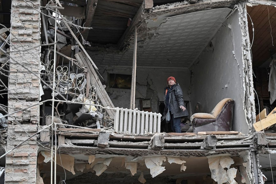 A resident stands in her flat in an apartment building hit by a Russian missile strike, amid Russia's attack on Ukraine, in Zaporizhzhia, Ukraine January 23, 2025.